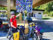 Cyclist points to sign in Italy