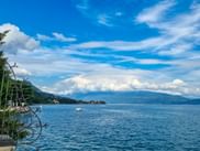 View of the blue Lake Garda under a blue sky