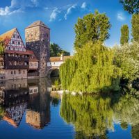 Half-timbered houses, bridges and a tower on the Pegnitz in Nuremberg