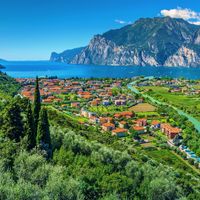 View of the town of Torbole on Lake Garda with mountain panorama