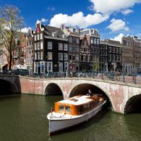 A boat on a canal in Amsterdam