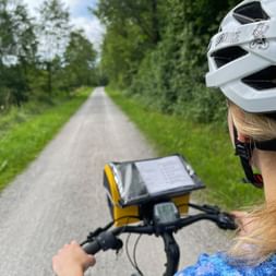 Looking over the shoulder of a cyclist on the Salzach cycle path