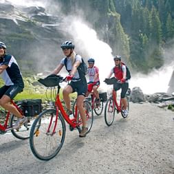 Cyclists at the Krimml Waterfalls