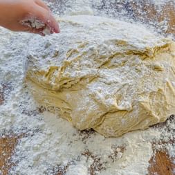Dough on a floured wooden work surface
