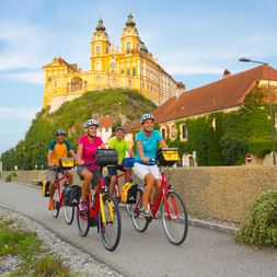 Cycling at sunset with a view of Melk Abbey