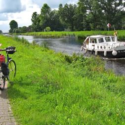 Cyclist looks down on a canal