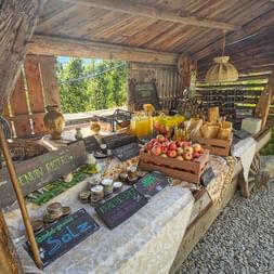 Market stall selling fresh fruit and wine in Plars, South Tyrol