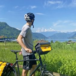 Cyclist views Lake Ossiach in Carinthia