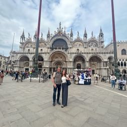 Father and daughter arriving at St. Mark's Square in Venice.