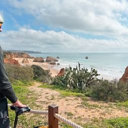 Cyclist looks out over the coast