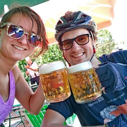 Cyclists drinking beer