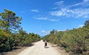 Sandy cycle path surrounded by bushes on the Cinque Terre
