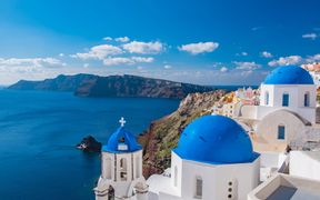 View over the blue domes of the church of Santorini