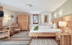 Swiss pine room at Biohotel Stillebach, nestled in the Tyrolean Alps