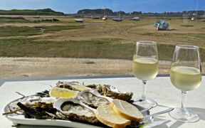 Oysters with white wine in a restaurant by the sea