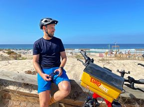 Cyclist takes a break on the beach between Setubal and Sines