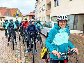 Group of cyclists stop in town