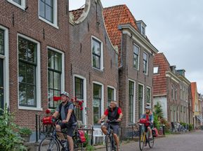 Cyclists ride through town on the IJsselmeer