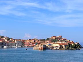 Picturesque view of Elba under a blue sky from a boat