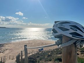 Sun, sea, and cyclist's helmet