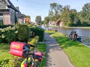 Small village on the IJsselmeer with houses and river