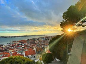 Evening atmosphere in Lisbon with a view of the city and the sea