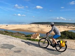 A cyclist enjoys the view of the Costa de Santo Andre