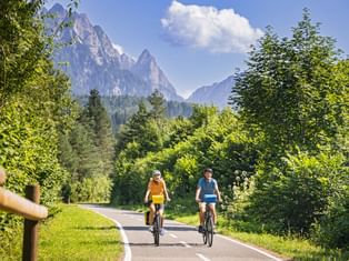 Cyclists in the canal valley near Tarvisio two cyclists in the canal valley near Tarvisio