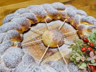 All Saints' Striezel in the shape of a wheel with flower decoration
