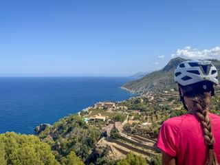 Cyclist gazes into the distance in Banyalbufar, Mallorca Cyclist gazes into the distance in Banyalbufar, Mallorca