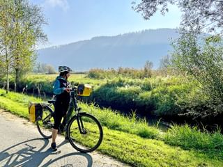 Cyclist on cycle path along the Glan