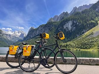 Eurobike rental bikes in front of Lake Gosau with mountains in the background