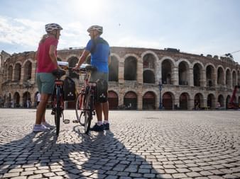 Cyclists in front of the arena in Verona