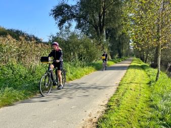 Cyclists on the cycle path along the Glan