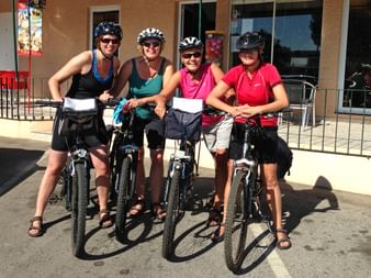 Four cyclists in front of a café