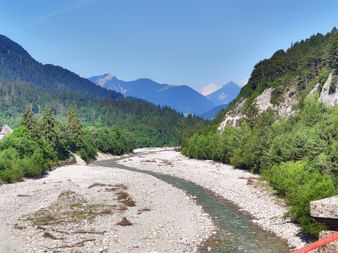 Riverbed in Tarvisio with mountain panorama