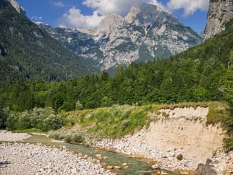 The Soca Valley in Slovenia Cycle path in the Soca Valley in Slovenia with the mountains in the background