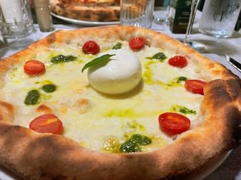 Pizza with tomatoes and mozzarella