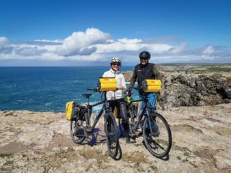 Cycling couple at Cabo Sao Vicente
