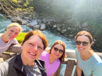 Cycling group takes a selfie on the wooden bridge on the Tauern cycle path