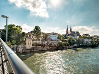 Photo from a bridge on the banks of the Rhine with a church in the background
