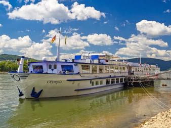 MS Olmpia at a pier on the Rhine River