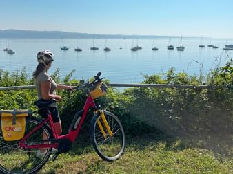 Cyclist looking at Lake Constance