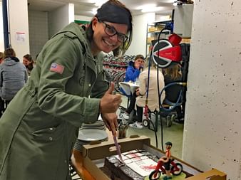 Claudia cutting her anniversary cake