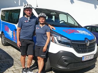 Ursula with her husband in front of the Eurobike bus