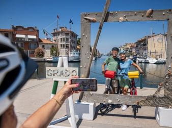 selfie at port grado Cyclists take a selfie at Grado harbour
