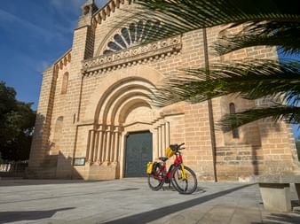 Eurobike rental bike in front of the church of Sant Miquel de Son Carrió