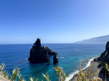 Large rock juts out of the sea