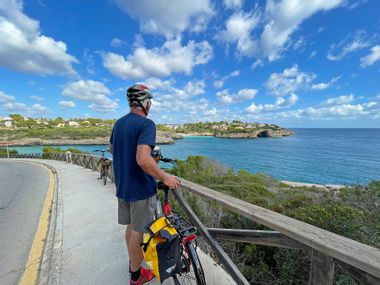 Cyclists on the bike path along the coast to Porto Cristo