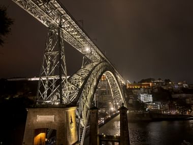 Illuminated bridge in Porto at night